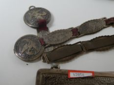 A silver purse hallmarked London 1917. Having two white metal and tortoiseshell design hair grips. A