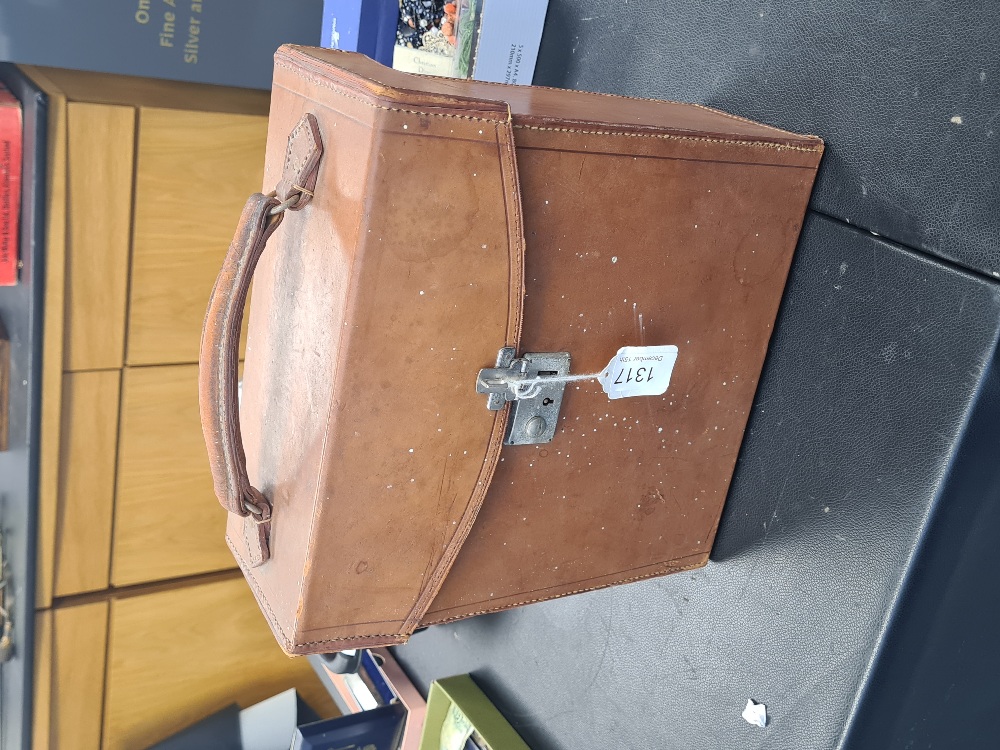 An early 20th Century, leather case containing folding maps (26)