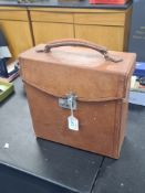 An early 20th Century, leather case containing folding maps (26)