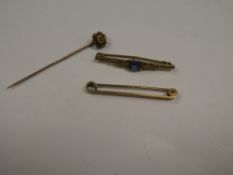 15ct yellow gold stick pin the head set with a diamond chip, 9ct bar brooch and yellow metal bar bro
