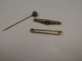 15ct yellow gold stick pin the head set with a diamond chip, 9ct bar brooch and yellow metal bar bro