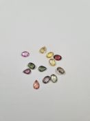 A quantity of rose cut coloured Sapphires, (12) purple, pink, yellow, red, etc, 7.7 carat approx