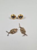 Pair of antique yellow metal earrings each set with central diamond and black enamel frame, and pair