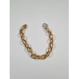 18ct yellow gold oval link bracelet, with attractive textured links and white gold lobster claw clas