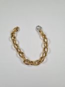 18ct yellow gold oval link bracelet, with attractive textured links and white gold lobster claw clas