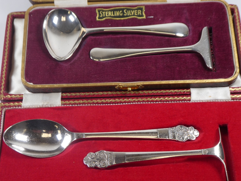 A cased silver pusher and spoon set having decorative embossed handles. Hallmarked Sheffield 1959, G - Image 2 of 2