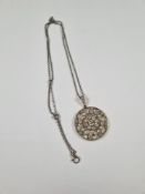 9ct white gold fine neckchain, hung with an unmarked white gold circular pendant inset with 41 rubov
