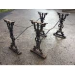 A pair of Victorian style rectangular cast iron table bases, the pierced scrolled ends on moulded