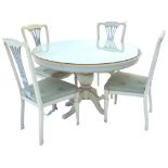 A circular painted breakfast table & chair set, the table with plate glass top and plain apron