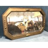 An oak framed mirror, the rectangular canted plate in wide bead & lozenge trimmed frame with gilt