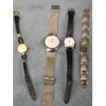 A 60s Omega ladies gold plated wristwatch with leather thong strap; and three other contemporary