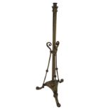 A late Victorian brass oil lamp base with telescopic column framed by three angled scrolled supports