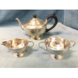 A hallmarked silver three-piece teaset with beaded rims - teapot, sucrié and jug - Birmingham - 19.9