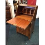 A small walnut bureau by Validity Furniture, the fallfront enclosing an interior with pigeonholes,