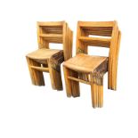 A set of twelve beech school chairs with bar backs and slatted seats, raised on square column legs