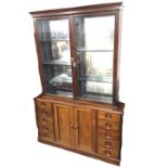A Victorian mahogany display cabinet or dresser, the associated top with moulded cornice above