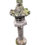 A composition stone Chinese style garden pagoda ornament, the circular lantern style enclosure