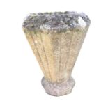 An octagonal tapering garden urn with chamfered rim and fluted sides on plinth. (19.5in)