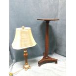 A Victorian mahogany jardiniere stand with octagonal platform on turned column above a triangular