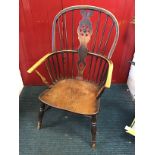 A nineteenth century country elm wheelback windsor chair with hoop on spindles framing pierced