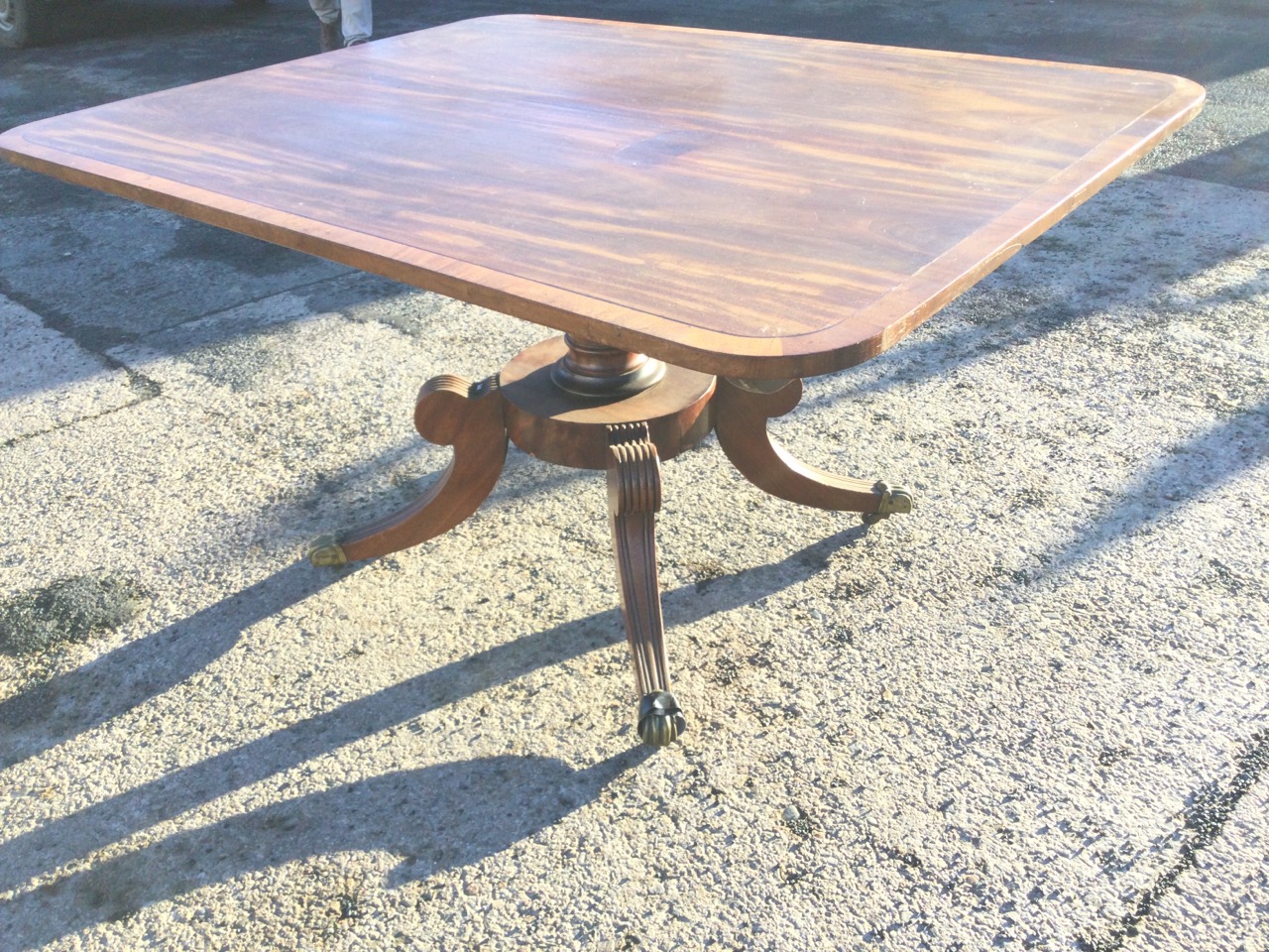 A regency mahogany breakfast table with rounded crossbanded top supported on a ribbed turned - Image 2 of 3