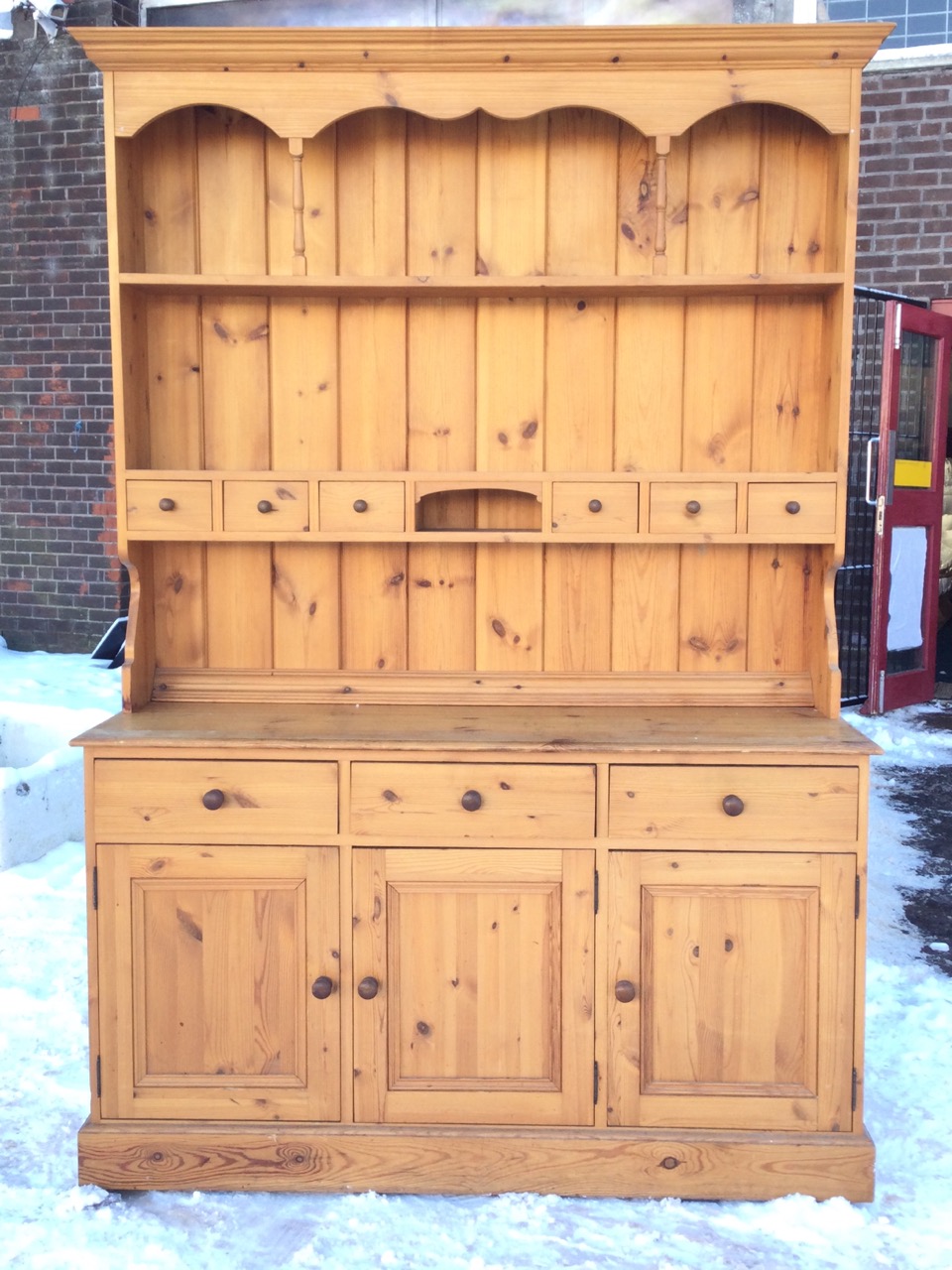 A pine dresser with moulded cornice to delft rack having shaped apron supported on spindles above an - Image 2 of 3