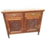 A late Victorian walnut sideboard with rectangular moulded top above two frieze drawers and a pair