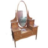 A late Victorian mahogany satinwood banded dressing table, the back with oval bevelled mirror on