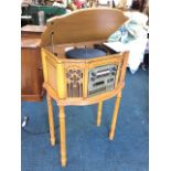 A vintage style music centre with turntable, MW/FM radio, cassette and CD player in bowfronted