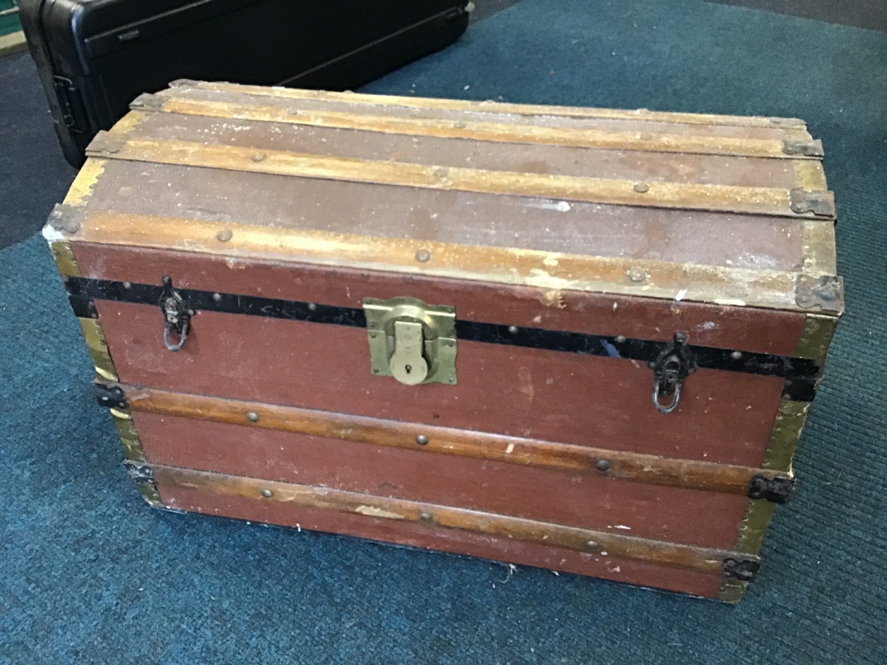 A dome top cabin trunk with studded pine batons, iron and brass mounts with brass lock. (33in x 18. - Image 2 of 3