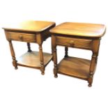 A pair of Ercol elm bedside tables with square rounded tops above ribbed frieze drawers, raised on