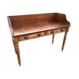 A nineteenth century mahogany Gillows style washstand with shaped upstand to single-piece top