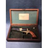 A rosewood cased six-shot baby Remington revolver, the non-firing Italian made gun in fitted box,