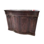A Victorian serpentine fronted rosewood chiffonier with frieze drawer above bowfronted cupboard