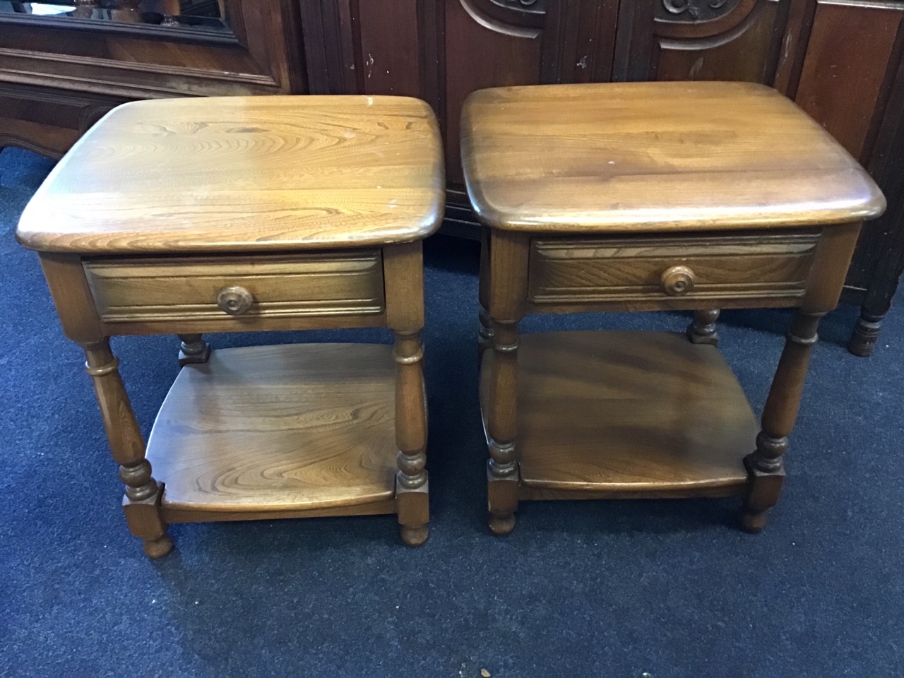 A pair of Ercol elm bedside tables with square rounded tops above ribbed frieze drawers, raised on - Image 3 of 3