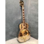 An Ozark national resonator steel string guitar, the instrument with leaf engraved decoration and