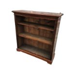 A stained Edwardian mahogany bookcase with rectangular moulded top above adjustable shelves framed