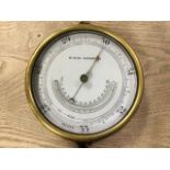 A C20th mining barometer with silvered dial under bevelled glass with brass bezel, in cast iron