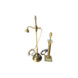 An adjustable brass rise & fall desk lamp with leaf cast handle to column, above a circular