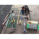 A quantity of miscellaneous garden tools - fork, spade, hoes, edgers, a Sovereign lawnmower, a