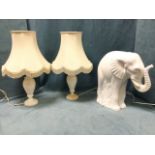 A pair of alabaster tablelamps of baluster form fitted with tasseled octagonal fabric shades; and