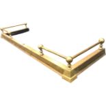 A telescopic brass fender, the plain curb mounted with tubular rails to sides with ball supports.