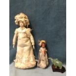 A porcelain doll with ceramic limbs and soft body, wearing lace trimmed dress & bonnet - 9.5in; a