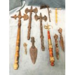 Six miscellaneous ornamental axes - brass, cast iron, wood, etc; and four spearheads or stylised