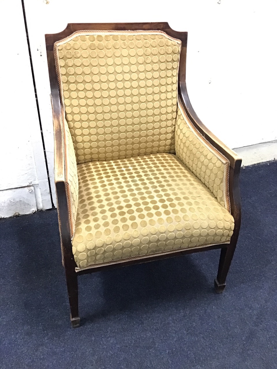 An Edwardian mahogany upholstered armchair, with downswept arms above a sprung seat, raised on - Image 2 of 3