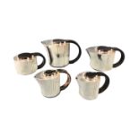 A Jean Elysée Purifcat ribbed deco five piece silver plated teaset with ebonised ring handles, the