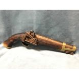 A replica Spanish flintlock service pistol with brass mounts, the lock with engraved decoration, the