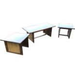 A set of three eastern coffee tables with plate glass tops on rectangular frames set with cane