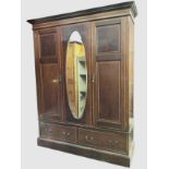 An Edwardian mahogany wardrobe inlaid with satinwood banding, with moulded cornice and plain