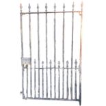 An Edwardian cast iron garden gate with square spindles having spear finials in rectangular frame,
